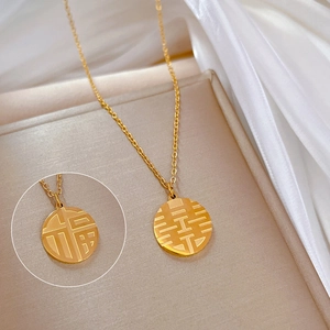 Gold titanium steel necklace featuring Fu and Xi character round pendant on silk background