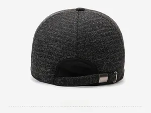 Detail view of the gray wool baseball cap with a metal adjustable buckle on the back