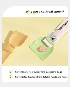 Detail of pet cat strip squeezer spoon in light green and yellow for feeding snacks