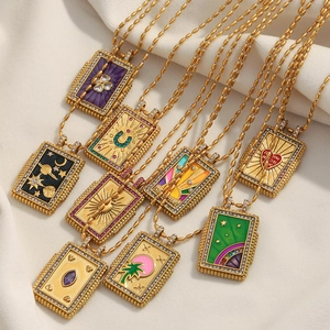 Detailed view of 18K gold plated tarot square pendants with colorful enamel patterns