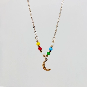Detail of 18k gold plated moon pendant necklace with colorful faceted beads and fine chain