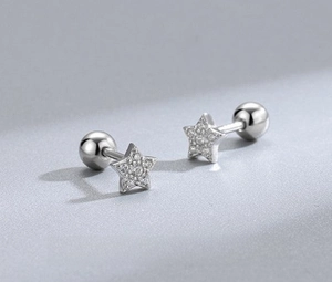 Close-up of star shaped 925 sterling silver stud earrings with sparkling cubic zirconia