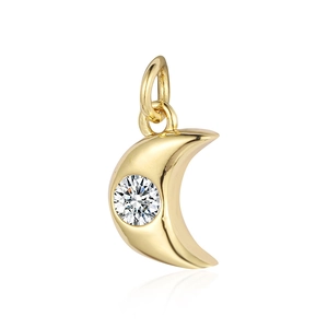 Macro shot of gold crescent moon pendant with sparkling zircon stone and jump ring