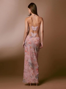 Detail of the pink mesh dress with back cross-lacing and 3D lace butterfly appliques