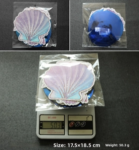 Detailed view of mermaid shell hanging swirl decorations set weighing fifty grams