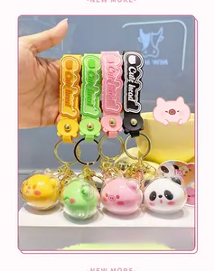 Detail view of colorful acrylic keychain pendants featuring cute cartoon animal figures