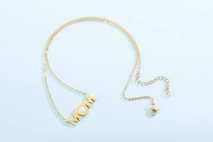 Detailed view of the lobster clasp and adjustable extension chain on the gold MOM necklace