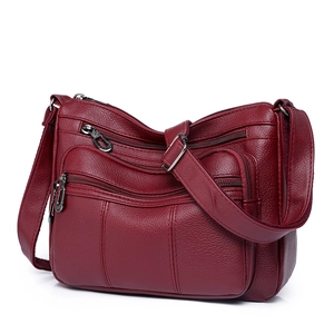 Vintage burgundy soft leather crossbody bag with multiple zipper pockets and adjustable strap