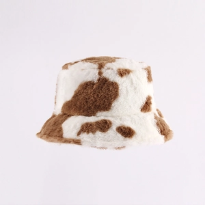 Plush faux fur cow print bucket hat in brown and white for winter warmth and fashion