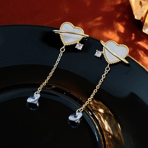 Elegant heart-shaped tassel earrings with white shell inlay and gold-plated chain detail