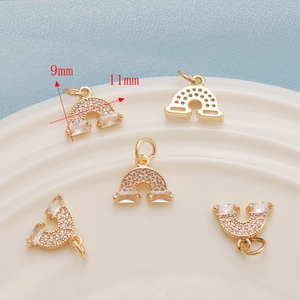 Macro view of 14K gold plated rainbow mushroom pendant with dimensions 9x11mm