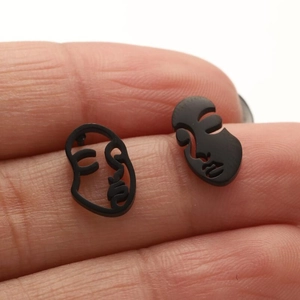Asymmetrical black abstract face stud earrings made of stainless steel for women
