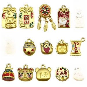 Golden DIY lucky charms set featuring Maneki Neko and fortune bags for jewelry making