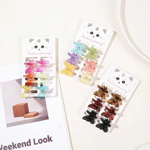 Set of 6 colorful butterfly hair clips with bionic texture on a white decorative display