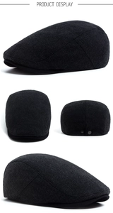 Detail view of herringbone flat cap featuring adjustable metal buckle on back