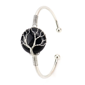 Detailed wire-wrapped silver tree of life bracelet featuring a round black gemstone