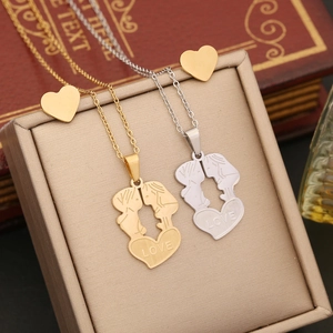Gold and silver stainless steel love heart necklaces and studs on a jewelry box