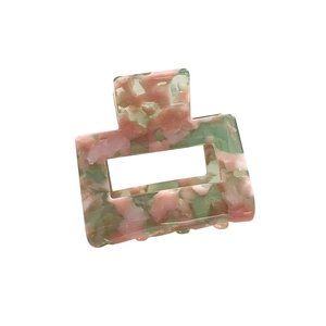 Pink and green marble acetate square hair claw clip with cutout geometric floral pattern