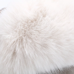 Close-up of the plush white faux fur lining on the warm winter trapper hat