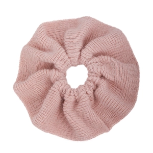 Chunky pink knitted ruffled hair scrunchie with soft wool texture for low ponytail styles