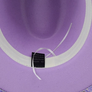 Purple wool fedora interior detail featuring adjustable white sweatband and material label