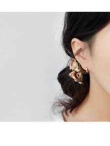 Minimalist S925 sterling silver geometric mini hoop earring on a model's earlobe
