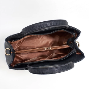 Top view of large black pebble leather tote bag with internal zipper divider and brown lining