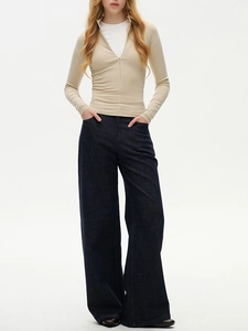 Slim fit beige half-neck zipper top paired with high-waist wide-leg blue denim jeans