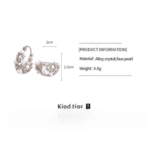 Detail view of silver hollow basket earrings with faux pearls and crystals, 2x2.5cm size