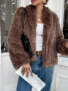 Women's casual brown fuzzy long-sleeve coat styled with jeans in a street fashion look