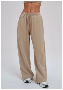 Detail of khaki wide-leg sweatpants featuring adjustable drawstring waist and soft cotton fabric