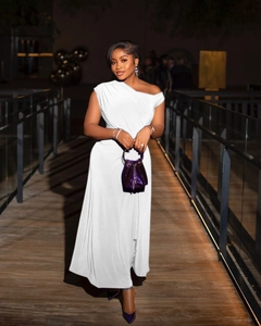 Elegant white one-shoulder maxi dress featuring detailed waist ruching and silky texture
