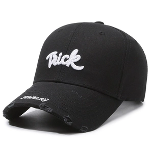 Distressed black cotton baseball cap with white Trick embroidery and frayed brim detail