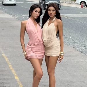 Detail of sexy deep V-neck halter mini dresses in pink and beige with mesh patchwork
