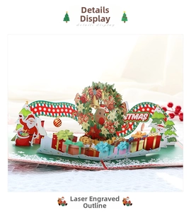 Close-up of 3D pop-up Christmas card featuring laser-cut Santa, reindeer, and snowman details