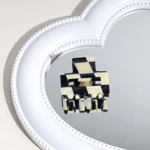 Classic black and white checkered acetate hair claw clip on heart shaped mirror surface