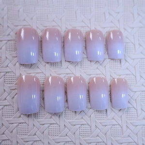 Short square press-on nails with pink to purple gradient and glossy finish, 10-piece set