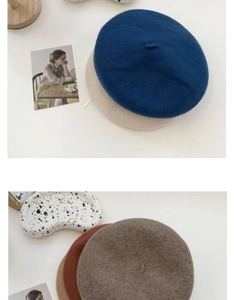 Flat lay of wool beret hats in navy, beige, and brown with vintage minimalist props