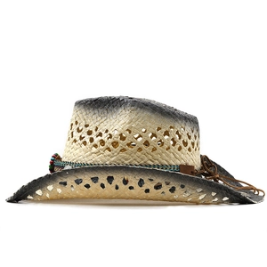 Detail of western straw cowboy hat featuring bead decorations and open weave texture