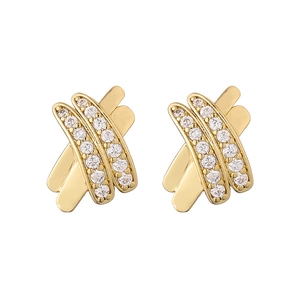 Golden criss-cross hoop earrings set with small white zircon stones on white background