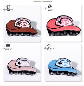 Detail view of 8cm denim hat hair claws with leopard print and star patterns in four colors