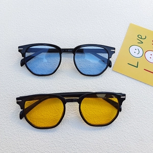 Classic retro men's sunglasses with black frames and tinted blue or yellow lenses