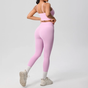 Rear view of pink yoga set showing thin strap sports bra and high-waist leggings