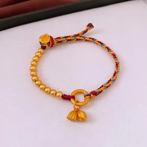 Woven silk bracelet with matte gold lotus pods and beads in Chinese retro style