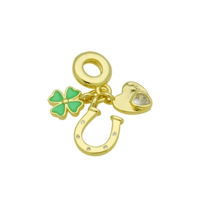 Detail of gold charms with green clover, horseshoe and heart for fashion bracelets