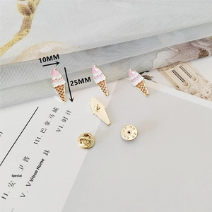 Detailed view of ice cream enamel pins with rubber and metal butterfly clutch backings