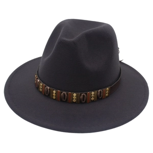 Detail of wool fedora hat with ethnic band featuring bronze beads and shell accents