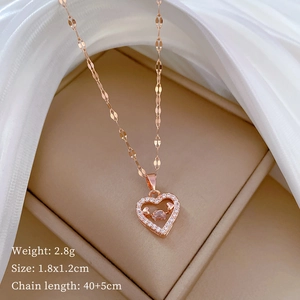 Rose gold heart pendant necklace with dancing stone and chain dimensions shown in box