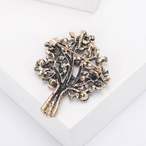 Detailed back view of vintage bronze tree brooch featuring secure pin closure mechanism