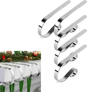 Set of 5 silver metal Christmas stocking hooks shown in both detail and fireplace setting